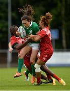 25 June 2016; Lucy Mulhall of Ireland is tackled by Ines Souissi, left, and Rawia Othmani, right, of Tunisia during the World Rugby Women's Sevens Olympic Repechage Quarter Final match between Ireland and Tunisia at UCD Sports Centre in Belfield, Dublin. Photo by Seb Daly/Sportsfile