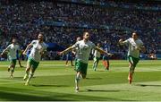 26 June 2016; Robbie Brady, centre, of the Republic of Ireland celebrates with teammates after scoring the opening goal in the UEFA Euro 2016 Round of 16 match between France and Republic of Ireland at Stade des Lumieres in Lyon, France. Photo by David Maher/Sportsfile