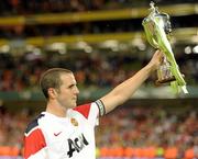 4 August 2010; Manchester United captain John O'Shea  holds up the Airtricity Challenge Trophy at the end of the game. Friendly Match, Airtricity League XI v Manchester United, Aviva Stadium, Lansdowne Road, Dublin. Picture credit: David Maher / SPORTSFILE