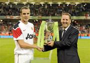 4 August 2010; Manchester United captain John O'Shea is presented with the Airtricity Challange Trophy by Kevin Greenhorn, Managing Director, Airtricity Supply. Friendly Match, Airtricity League XI v Manchester United, Aviva Stadium, Lansdowne Road, Dublin. Picture credit: Brendan Moran / SPORTSFILE