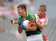 31 July 2010; Ferghal McNamara, Kerry, is tackled by Richard Donnelly, Tyrone. ESB GAA Football All-Ireland Minor Championship Quarter-Final, Tyrone v Kerry, Croke Park, Dublin. Picture credit: Ray McManus / SPORTSFILE