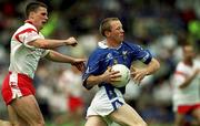 8 July 2001; Jason Reilly of Cavan in action against Colin Holmes of Tyrone during the Bank of Ireland Ulster Senior Football Championship Final match between Tyrone and Cavan at St Tiernach's Park in Clones, Monaghan. Photo by David Maher/Sportsfile