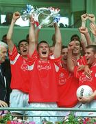 8 July 2001; Tyrone captain Peter Donnelly lifts the cup after the Ulster Minor Football Championship Final match between Tyrone and Monaghan at St Tiernach's Park in Clones, Monaghan. Photo by Damien Eagers/Sportsfile