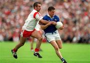 8 July 2001; Finbarr O'Reilly of Cavan in action against Declan McCrossan of Tyrone during the Bank of Ireland Ulster Senior Football Championship Final match between Tyrone and Cavan at St Tiernach's Park in Clones, Monaghan. Photo by Damien Eagers/Sportsfile