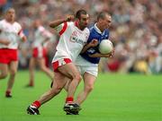8 July 2001; Paul Galligan of Cavan in action against Declan McCrossan of Tyrone during the Bank of Ireland Ulster Senior Football Championship Final match between Tyrone and Cavan at St Tiernach's Park in Clones, Monaghan. Photo by Damien Eagers/Sportsfile