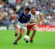 8 July 2001; Peter Reilly of Cavan in action against Declan McCrossan of Tyrone during the Bank of Ireland Ulster Senior Football Championship Final match between Tyrone and Cavan at St Tiernach's Park in Clones, Monaghan. Photo by Damien Eagers/Sportsfile