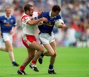 8 July 2001; Thomas Prior of Cavan in action against Declan McCrossan of Tyrone during the Bank of Ireland Ulster Senior Football Championship Final match between Tyrone and Cavan at St Tiernach's Park in Clones, Monaghan. Photo by Damien Eagers/Sportsfile