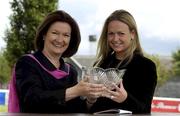 14 July 2001; Ms Kate Magnier, right, daughter of winning owner Mr John Magnier, is presented with the trophy by Ms Catherina Oxx, left, after sending out Johannesburg to win the Anglesey Stakes at the Curragh Racecourse in Kildare. Photo by Damien Eagers/Sportsfile