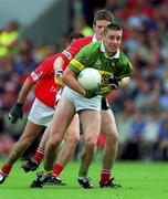 15 July 2001; Darragh O Sé of Kerry is tackled by Derek Kavanagh of Cork during the Bank of Ireland Munster Senior Football Championship Final match between Cork and Kerry in Pairc Ui Chaoimh in Cork. Photo by Ray McManus/Sportsfile