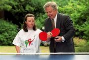 17 July 2001; Laura Jane Dunne, from Blackrock in Dublin practices her table tennis skills with the help of irish Shell managing Director Michael Forde at the announcement of 14 Official Suppliers for the 2003 Special Olympics World Summer Games, which take place in Ireland, bringing the sponsorship raised to date for the games to £12 million the largest ever raised sponsorship for a single or cultural event in Ireland. Photo by Brendan Moran/Sportsfile