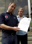 17 July 2001; Bohemians club secretary Gerry Cuffe, left, and club president Felim O'Reilly examine faxes in Tallinn, Estonia, sent from UEFA regarding the appeal of FC Levadia Maardu to have the first leg replayed due to the regulated height of the goal at Dalymount Park not been achieved. Photo by David Maher/Sportsfile