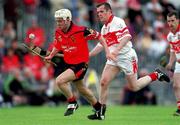 15 July 2001; Gary Gordon of Down in action against Benny Ward of Derry during the Guinness Ulster Senior Hurling Championship Final match between Derry and Down at Casement Park in Belfast. Photo by Aoife Rice/Sportsfile