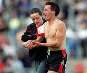 15 July 2001; Martin Coulter Snr of Down leaves the pitch with a shoulder injury during the Guinness Ulster Senior Hurling Championship Final match between Derry and Down at Casement Park in Belfast. Photo by Aoife Rice/Sportsfile