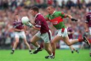 21 July 2001; David Mitchell of Westmeath in action against Trevor Mortimer of Mayo during the Bank of Ireland All-Ireland Senior Football Championship Qualifier Round 4 match between Mayo and Westmeath at Dr. Hyde Park in Roscommon. Photo by David Maher/Sportsfile