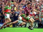 21 July 2001; Ray Connelly of Mayo in action against Damien Healy of Westmeath during the Bank of Ireland All-Ireland Senior Football Championship Qualifier Round 4 match between Mayo and Westmeath at Dr. Hyde Park in Roscommon. Photo by David Maher/Sportsfile
