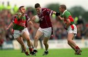 21 July 2001; David O'Shaughnessy of Westmeath holds off the challenge of Colm McManaman, left, and Trevor Mortimer of Mayo during the Bank of Ireland All-Ireland Senior Football Championship Qualifier Round 4 match between Mayo and Westmeath at Dr. Hyde Park in Roscommon. Photo by Damien Eagers/Sportsfile