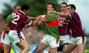 21 July 2001; Pat Fallon of Mayo is tackled by Westmeath players, from left, Joe Fallon, Damien Healy and John Keane during the Bank of Ireland All-Ireland Senior Football Championship Qualifier Round 4 match between Mayo and Westmeath at Dr. Hyde Park in Roscommon. Photo by David Maher/Sportsfile