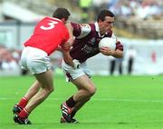 22 July 2001; Padraig Joyce of Galway in action against Graham Canty of Cork during the Bank of Ireland All-Ireland Senior Football Championship Qualifier Round 4 match between Galway and Cork at Croke Park in Dublin. Photo by Brian Lawless/Sportsfile
