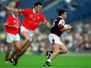 22 July 2001; Tommy Joyce of Galway in action against Derek Kavanagh of Cork during the Bank of Ireland All-Ireland Senior Football Championship Qualifier Round 4 match between Galway and Cork at Croke Park in Dublin. Photo by Brendan Moran/Sportsfile