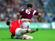 22 July 2001; Tomas Mannion of Galway, is tackled by Philip Clifford of Cork during the Bank of Ireland All-Ireland Senior Football Championship Qualifier Round 4 match between Galway and Cork at Croke Park in Dublin. Photo by Brendan Moran/Sportsfile
