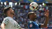 26 June 2016; Shane Long of Republic of Ireland challenges Patrice Evra of France during the UEFA Euro 2016 Round of 16 match between France and Republic of Ireland at Stade des Lumieres in Lyon, France. Photo by David Maher/Sportsfile