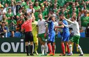 26 June 2016; Shane Duffy of Republic of Ireland receives a red card from referee Nicola Rizzoli from Italy during the UEFA Euro 2016 Round of 16 match between France and Republic of Ireland at Stade des Lumieres in Lyon, France. Photo by Stephen McCarthy/Sportsfile