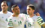 26 June 2016; Jon Walters consoles teammate Robbie Brady of Republic of Ireland after the defeat to France in the UEFA Euro 2016 Round of 16 match between France and Republic of Ireland at Stade des Lumieres in Lyon, France. Photo by Stephen McCarthy/Sportsfile
