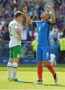 26 June 2016; Dimitri Payet of France celebrates beside Seamus Coleman of the Republic of Ireland after France's victory in the UEFA Euro 2016 Round of 16 match between France and Republic of Ireland at Stade des Lumieres in Lyon, France. Photo by David Maher/Sportsfile