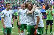 26 June 2016; Stephen Quinn consoles Shane Long of Republic of Ireland after the UEFA Euro 2016 Round of 16 match between France and Republic of Ireland at Stade des Lumieres in Lyon, France. Photo by David Maher/Sportsfile