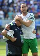 26 June 2016; John O'Shea of Republic of Ireland consoles kit man Dick Redmond after the defeat to France in the UEFA Euro 2016 Round of 16 match between France and Republic of Ireland at Stade des Lumieres in Lyon, France. Photo by David Maher/Sportsfile