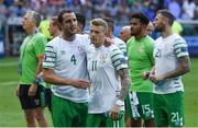 26 June 2016; John O'Shea and James McClean of Republic of Ireland embrace after defeat in the UEFA Euro 2016 Round of 16 match between France and Republic of Ireland at Stade des Lumieres in Lyon, France. Photo by Ray McManus/Sportsfile