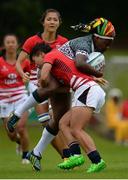 26 June 2016; Charity Mucucuti of Zimbabwe is tackled by Lee Tsz Ting of Hong Kong during the World Rugby Women's Sevens Olympic Repechage Trophy Quarter Final match between Hong Kong and Zimbabwe at UCD Sports Centre in Belfield, Dublin. Photo by Seb Daly/Sportsfile