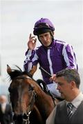 8 August 2010; Johnny Murtagh salutes to the crowd after winning the Keeneland Royal Whip Stakes (Group 2) on Fame and Glory. Curragh Racecourse, Co. Kildare. Picture credit: Barry Cregg / SPORTSFILE