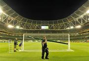 4 August 2010; Head groundsman Majella Smyth, left, with his groundstaff Stuart Wilson, 2nd left, and Paddy Madden, right, take down the goalposts after the game. Friendly Match, Airtricity League XI v Manchester United, Aviva Stadium, Lansdowne Road, Dublin. Picture credit: Brendan Moran / SPORTSFILE