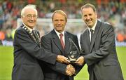4 August 2010; David Blood, left, President of the FAI, and Kevin Greenhorn, right, Managing Director, Airtricity Supply, make a presentation to Johnny Matthews, from Waterford, during half-time. Friendly Match, Airtricity League XI v Manchester United, Aviva Stadium, Lansdowne Road, Dublin. Picture credit: Brendan Moran / SPORTSFILE