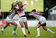 25 June 2016; Saoussen Dellagi of Tunisia is tackled by Marianny Izarza, left, and Daniela Diaz of Venezuela during the World Rugby Women's Sevens Olympic Repechage Pool B match between Venezuela and Tunisia at UCD Sports Centre in Belfield, Dublin. Photo by Seb Daly/Sportsfile