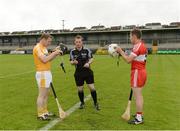19 June 2016; Referee James Clarke with captains Neal McAuley of Antrim, left, and Seán McCullagh of Derry prior to the Ulster GAA Hurling Senior Championship Semi-Final match between Derry and Antrim at the Athletic Grounds in Armagh. Photo by Piaras Ó Mídheach/Sportsfile
