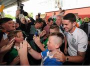 27 June 2016; Robbie Brady of Republic of Ireland poses for a photo with a supporter during their return from UEFA Euro 2016 in France at Dublin Airport, Dublin. Photo by Seb Daly/Sportsfile