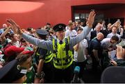 27 June 2016; A member of the airport police attempts to control the crowd during the Republic of Ireland team return from UEFA Euro 2016 in France at Dublin Airport, Dublin. Photo by Seb Daly/Sportsfile