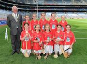 8 August 2010; President of the INTO Jim Higgins pictured with the Cork camogie team, including; Laura Doherty, Raharney N.S., Mullingar, Co. Westmeath, Aoibhe Ní Thiarnáin, Gaelscoil de hÍde, Co. Roscommon, Anna Weir, Raharney N.S., Mullingar, Co. Westmeath, Jackie Carr, Rathnure N.S., Enniscorthy, Co. Wexford, Leah Rowe, Runnamoat N.S., Ballinaheglish, Co. Roscommon, Una Sinnott, Monaseed N.S., Gorey, Co. Wexford, Emma Young, St. Clare’s N.S., Harold’s Cross, Co. Dublin, Danika Donnelly, Mother of Divine Grace N.S., Co. Dublin, Lisa Reid, Straide N.S., Foxford, Co. Mayo, Emma Gormley, Glanduff N.S., Kiltoom, Co. Roscommon. GAA Into Mini-Sevens during half time of the GAA Hurling All-Ireland Senior Championship Semi-Final, Kilkenny v Cork, Croke Park, Dublin. Picture credit: Ray McManus / SPORTSFILE