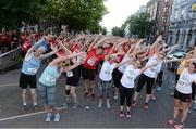 29 June 2016; A general view of the group warm up ahead of the Grant Thornton Corporate 5km Team Challenge at The Mall in Cork City. Photo by Matt Browne/Sportsfile