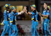 29 June 2016; Darren Sammy, from left, David Miller, Shane Watson, and Morne Morkel of St Lucia Zouks celebrate the dismissal of Dwayne Bravo of Trinbago Knight Riders during Match 1 of the Hero Caribbean Premier League between Trinbago Knight Riders and St Lucia Zouks at the Queen's Park Oval in Port of Spain, Trinidad. Photo by: Randy Brooks/Sportsfile