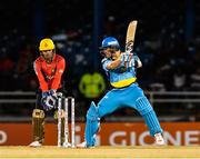 29 June 2016; Shane Watson of St Lucia Zouks hits 4 during Match 1 of the Hero Caribbean Premier League between Trinbago Knight Riders and St Lucia Zouks at the Queen's Park Oval in Port of Spain, Trinidad. The keeper is Umar Akmal of Trinbago Knight Riders. Photo by Randy Brooks/Sportsfile