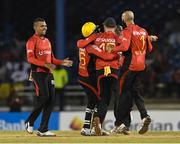 29 June 2016; Sunil Narine, left, of Trinbago Knight Riders celebrates with teammates the dismissal of Johnson Charles of St Lucia Zouks during Match 1 of the Hero Caribbean Premier League between Trinbago Knight Riders and St Lucia Zouks at the Queen's Park Oval in Port of Spain, Trinidad. Photo by Randy Brooks/Sportsfile