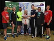29 June 2016; Georgina Drumm, President of Athletics Ireland presents a trophy to the winning men's team from the Irish Naval Service after the Grant Thornton Corporate 5km Team Challenge at The Mall in Cork City. Photo by Matt Browne/Sportsfile