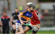 30 June 2016; Dylan Walsh of Tipperary in action against Ross Howell of Cork during the Electric Ireland Munster GAA Hurling Minor Championship Semi-Final game between Cork and Tipperary at Pairc Ui Rinn in Cork. Photo by Eóin Noonan/Sportsfile