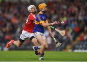 30 June 2016; Cian Darcy of Tipperary in action against Ross Howell of Cork during the Electric Ireland Munster GAA Hurling Minor Championship Semi-Final game between Cork and Tipperary at Pairc Ui Rinn in Cork. Photo by Eóin Noonan/Sportsfile
