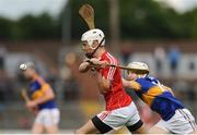 30 June 2016; Ross Howell of Cork in action against Lyndon Fairbrother of Tipperary during the Electric Ireland Munster GAA Hurling Minor Championship Semi-Final game between Cork and Tipperary at Pairc Ui Rinn in Cork. Photo by Eóin Noonan/Sportsfile