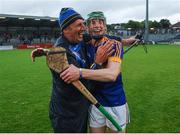 30 June 2016; Brian McGrath of Tipperary celebrates with selector Sean Corbett after the Electric Ireland Munster GAA Hurling Minor Championship Semi-Final game between Cork and Tipperary at Pairc Ui Rinn in Cork. Photo by Eóin Noonan/Sportsfile