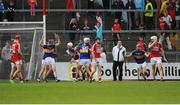 30 June 2016; Tipperary players celebrate at the final whistle during the Electric Ireland Munster GAA Hurling Minor Championship Semi-Final game between Cork and Tipperary at Pairc Ui Rinn in Cork. Photo by Eóin Noonan/Sportsfile